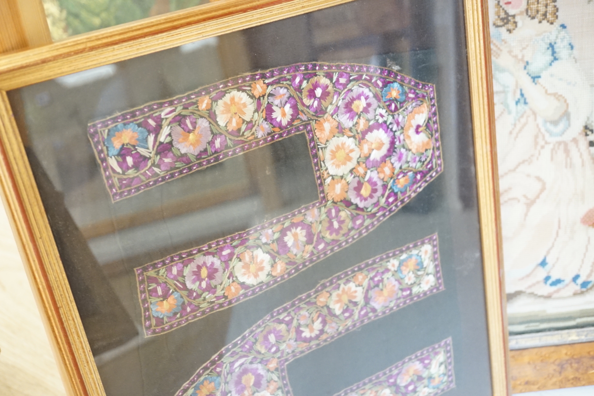 A framed Regency embroidery, two later figurative embroideries and a pair of embroidered slipper fronts, Regency embroidery 37cm wide, 41cm high